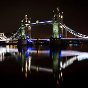 Tower Bridge and reflections in the River Thames at night, London, England
