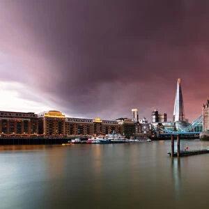 Tower Bridge and The Shard at sunset with storm clouds, London, England, United Kingdom