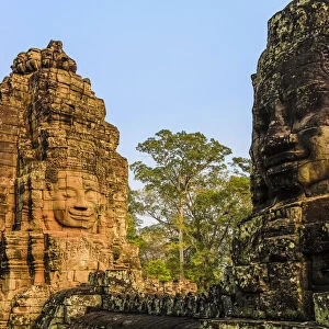 Towers and three of the 216 smiling sandstone faces at 12th century Bayon temple
