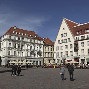 Town Hall Square, surrounded by grand, historic buildings, many now used as bars and cafes, in Tallinn, Estonia, Europe