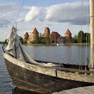 Traditional boat and Trakai Castle