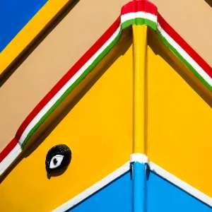 Detail of traditional brightly painted fishing boat in the harbour at Marsaxlokk