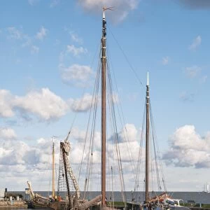 Traditional Dutch merchant ship sailing into Volendam harbour, North Holland Province, The Netherlands (Holland), Europe