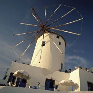 Traditional thatched windmill in the village of Oia