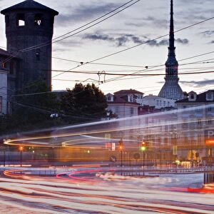 Traffic rushes through Piazza Castello, Turin, Piedmont, Italy, Europe