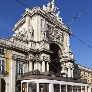 Tram (electricos) below the Arco da Rua Augusta in Praca do Comercio, Baixa, Lisbon, Portugal, Europe