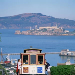 Tram on Russian Hill with view over Alcatraz, San Francisco, California