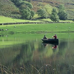 Tranquil scene of two men in a boat on a lake, fly fishing, Watendlath Tarn