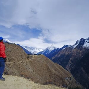 Trekker looking at Ama Dablan and other mountains of the Himalayas