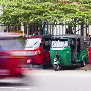 A tuk tuk speeding through the streets, Anuradahapura, North Central Province, Sri Lanka, Asia