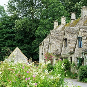 Typical Cotswold houses in the village of Bibury, The Cotswolds, Gloucestershire