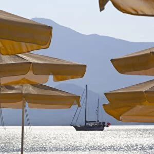 Umbrellas and yacht, Psili Ammos, Samos, Aegean Islands, Greece