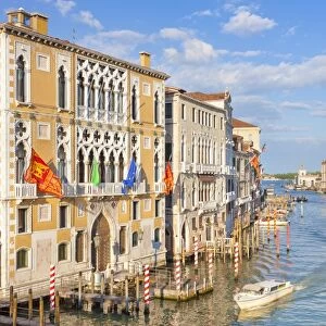 Vaporettos (water taxis) passing Palazzo Cavalli-Franchetti, on the Grand Canal, Venice