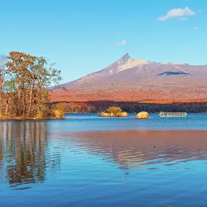 Vibrant autumn colors reflecting in Lake Onuma, with view to Hokkaido Koma-ga-take volcano, Onuma, Hokkaido, Japan, Asia