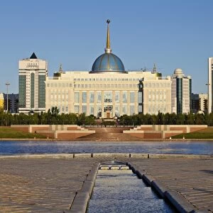 View of The Ak Orda Presidential Palace of President Nursultan Nazarbayev reflecting in Ishim River, Astana, Kazakhstan, Central Asia, Asia