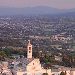 View over Assisi to Santa Chiara Basilica at sunset, Assisi, Perugia District, Umbria