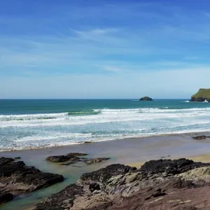 View of Atlantic surf at Polzeath beach, looking north to Pentire Headland