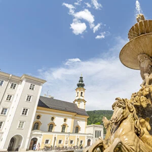 View of Baroque Fountain and Salzburger Glockenspiel in Residenzplatz, Salzburg, Austria
