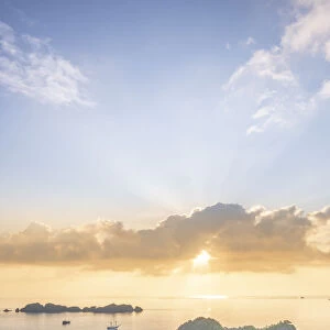 View over a bay of islands at dawn from the Piaynemo lookout, Raja Ampat, West Papua