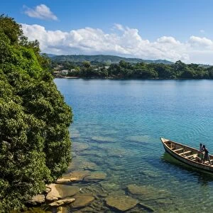View over a canoe on Nkhata Bay, Lake Malawi, Malawi, Africa