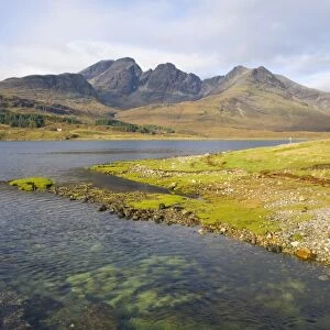 View across the clear waters of Loch Slapin to the Cuillin Hills, the peak of Bla Bheinn