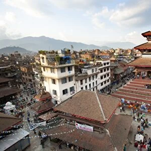 View over Durbar Square from rooftop cafe showing temples and busy streets