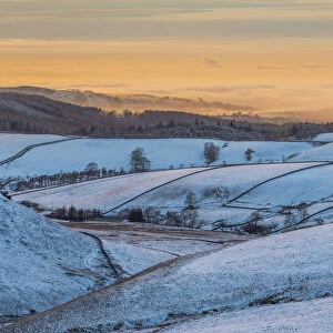 View of frozen landscape near Macclesfield at sunset, High Peak, Cheshire, England