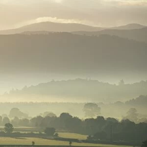 View of hills and landscape in early morning mist, River Derwent Valley