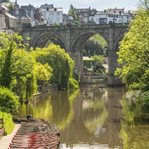 View of Knaresborough viaduct and the River Nidd with town houses in the background