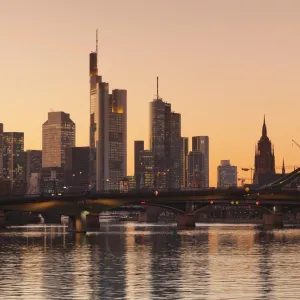 View over Main River to Floesserbruecke bridge and financial district, Frankfurt