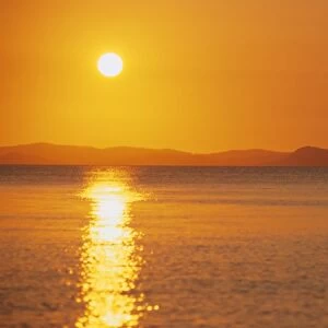 View to mainland from Monkey Beach at sunset, Great Keppel Island, Queensland, Australia