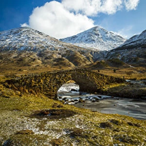 View of mountains and Cattle Bridge in winter, in the Argyll Forest and National Park