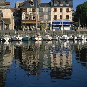 View across old harbour to restaurant on the St. Etienne Quay, at Honfleur