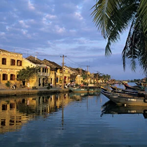 View of old town and fishing boats along Thu Bon River, Hoi An, UNESCO World Heritage Site, South Central Coast, Vietnam, Indochina, Southeast Asia, Asia