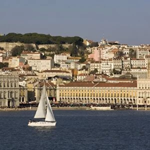 View from River Tagus, showing Praca Comercio, with demonstration, castle and cathedral, Lisbon, Portugal, Europe