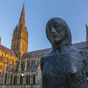 View of Salisbury Cathedral and statue at sunset, Salisbury, Wiltshire, England