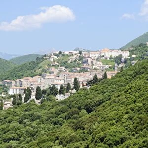 View of Sartene town in wooded mountainous setting, Corsica, France, Europe