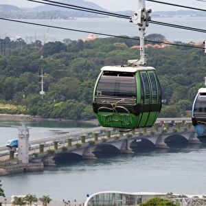 View of Sentosa Island cable car and road bridge across
