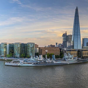 View of The Shard, HMS Belfast and River Thames from Cheval Three Quays at sunset, London