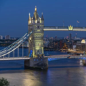 View of Tower Bridge from Cheval Three Quays at dusk, London, England, United Kingdom