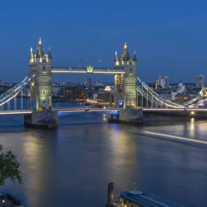 View of Tower Bridge and River Thames from Cheval Three Quays at dusk, London, England