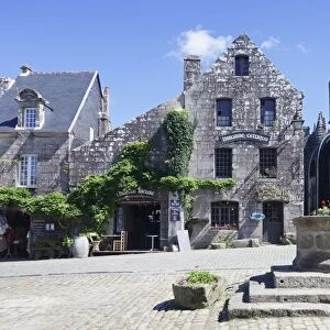 View of the towns Grand Place with historical buildings, Locronan, Finistere, Brittany, France, Europe