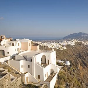 View along volcanic cliffs towards distant Fira, Imerovigli, Santorini (Thira) (Thera), Cyclades Islands, South Aegean, Greek Islands, Greece, Europe