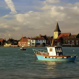 View across water at high tide, Bosham village and harbour, Sussex, England