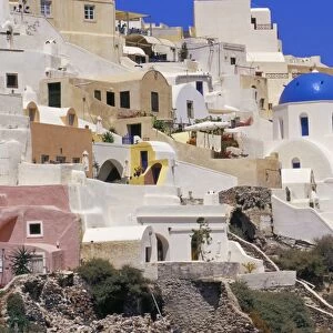Village of Oia with blue churches and colourful dwellings