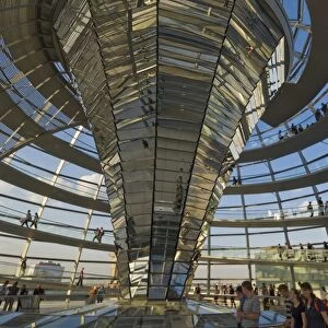 Visitors walk up a spiralling ramp around the cone shaped funnel in the dome cupola