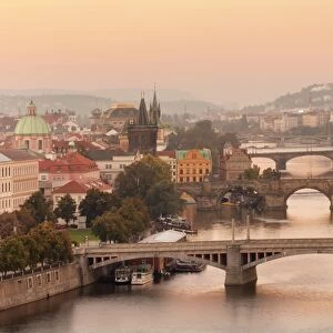 Vltana River with the bridges, Charles Bridge (UNESCO World Heritage Site) and the Old Town Bridge Tower at Sunrise, Prague, Bohemia, Czech Republic