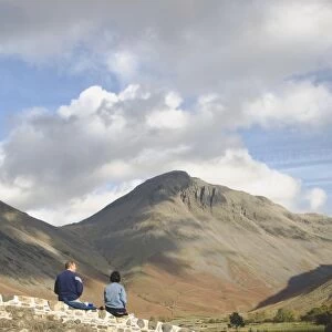 Two walkers pause, looking to Great Gable 2949ft, Wasdale Valley, Lake District National Park