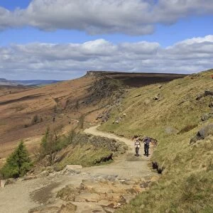 Walkers, Stanage Edge, on a fine spring day, near Hathersage, Peak District National Park