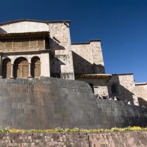 Wall in the foreground of the Inca ruin of Coricancha, with the church of Santo Domingo in the background, Cuzco, Peru